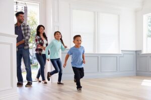 Family walking into an empty home